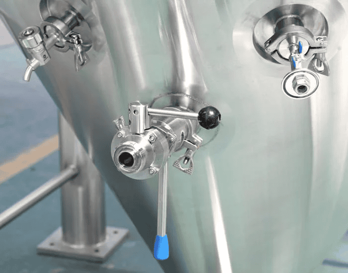 Close-up of beer tank valve with tri-clamp fitting
